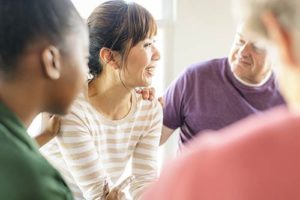 woman talking in a trauma therapy program