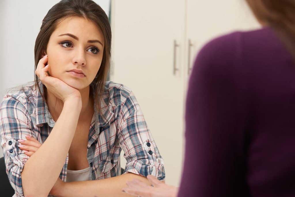 teenage girl staringand wondering what is crisis intervention