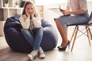 Teen-aged girl experiencing cognitive-behavioral therapy techniques